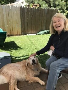 Resident with her dog, prior to moving in